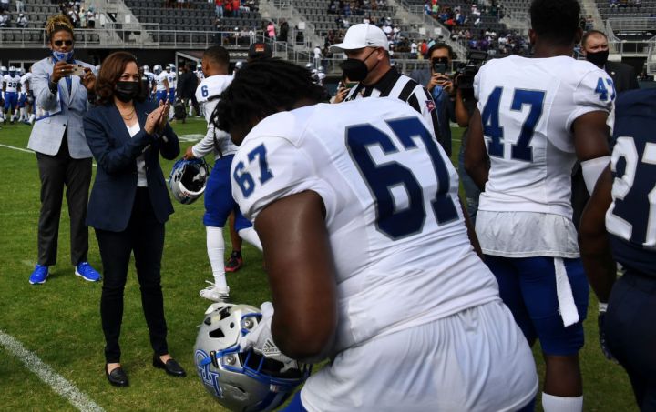 US Vice President Kamala Harris Applauds After Tossing The Coin