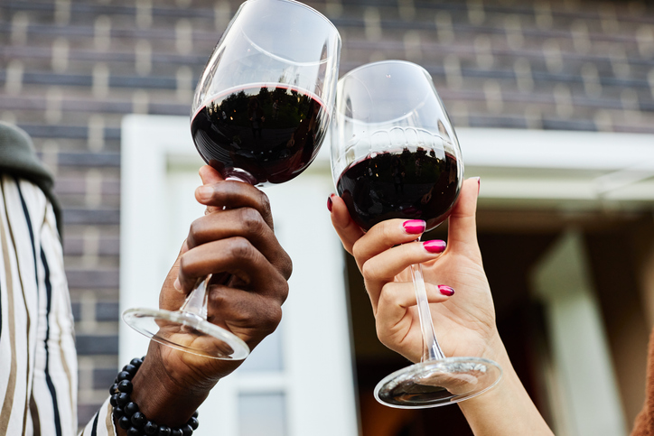 Couple Holding Wine Glasses Outdoors